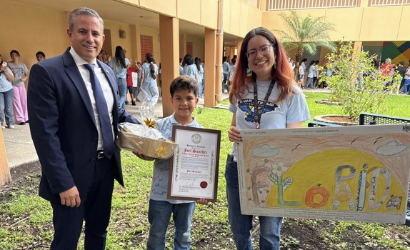 Tax Collector Dariel Fernandez Celebrates Student Joel Sanchez’s Winning Achievement in the 2026 Kids Tag Art Competition